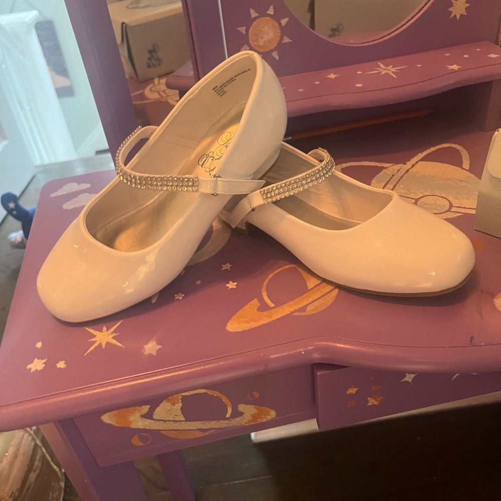 white patent mary Jane shoes with rhinestone strap